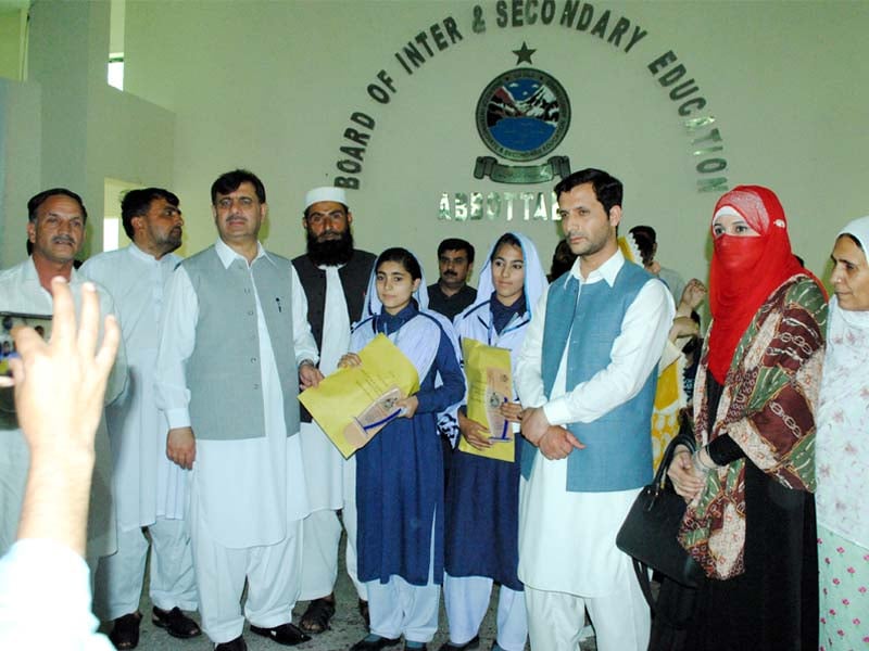 bise officials hand position holders certificates and shields in abbottabad photo express