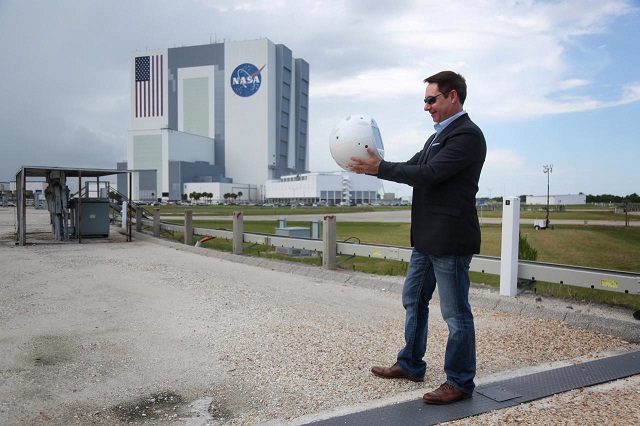 bret greenstein of ibm holds an artificial intelligence bot named cimon following a news conference at the kennedy space center in florida u s june 28 2018 photo reuters