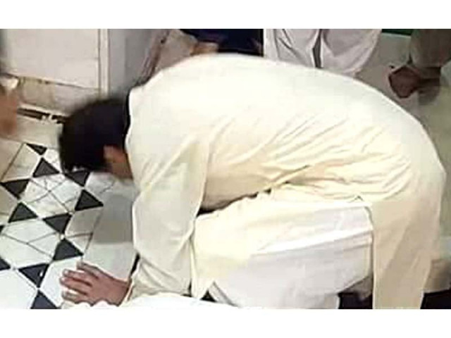 pti chief imran khan appears to be kneeling in prayer but says he was kissing the ground screengrab pti chief imran khan appears to be kneeling in prayer but says he was kissing the ground screengrab
