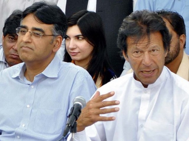 pti 039 s asad umar l next to imran khan r photo express