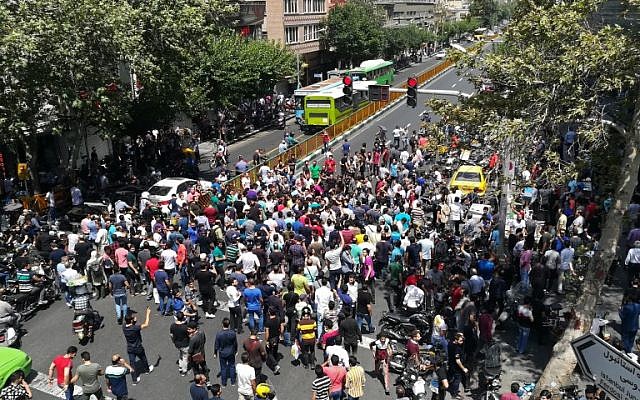 irani protesters gathered on a street photo afp