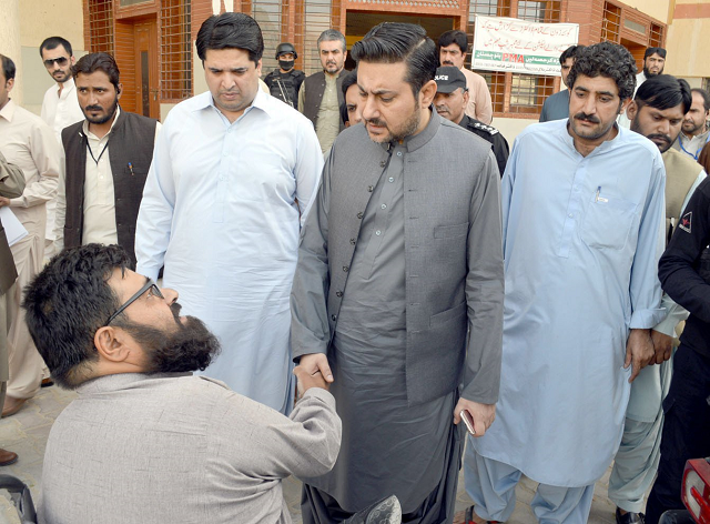 caretaker chief minister alauddin marri interacts with a patient during his visit to the hospital photo express