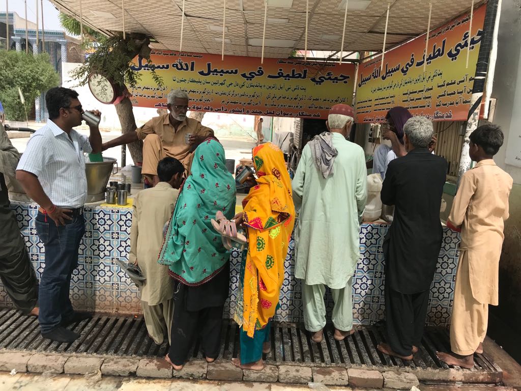 people enjoying chilled water at the sabeel managed by ishwar das at the shrine of hazrat shah abdul latif bhittai photo express