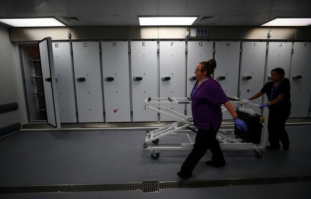 hospital staff prepare to receive a body in the mortuary at milton keynes university hospital england a south african women was found alive in a morgue fridge several hours after she was pronounced dead at the scene of a car crash photo reuters