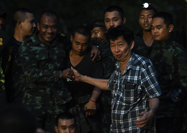 a father of a missing footballer thanks soldiers near tham luang cave following news all members of the children 039 s football team and their coach were alive in the cave at khun nam nang non forest park in the mae sai district photo afp a father of a missing footballer thanks soldiers near tham luang cave following news all members of the children 039 s football team and their coach were alive in the cave at khun nam nang non forest park in the mae sai district photo afp