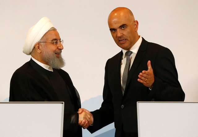 iranian president hassan rouhani l and swiss president alain berset shake hands during a joint press conference following various signing ceremonies in bern on july 3 2018 photo afp