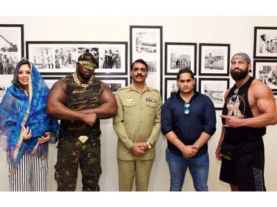 pro wrestlers arrive in pakistan to promote international event in august