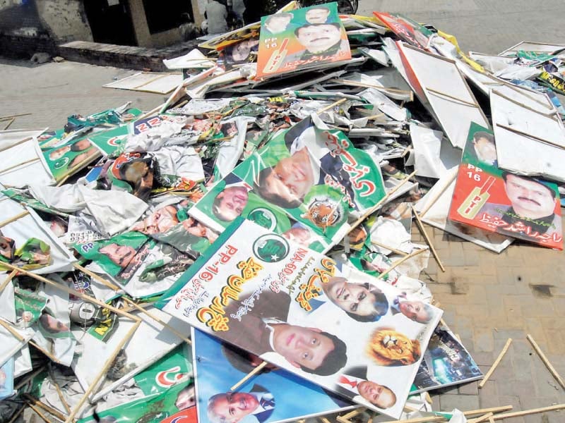 publicity material of candidates removed from metro bus lies on the ground at tma office in rawalpindi photo nni