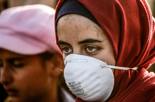 a palestinian demonstrator wearing a mask at the rally photo afp a palestinian demonstrator wearing a mask at the rally photo afp