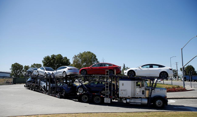 a car carrier trailer carries tesla model 3 electric sedans is seen outside the tesla factory in fremont california us june 22 2018 photo reuters