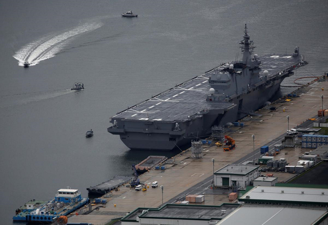in order for japan to take a wider regional role prime minister shinzo abe s government has stretched the limits of a post war pacifist constitution by sending warships planes and troops on overseas missions photo reuters