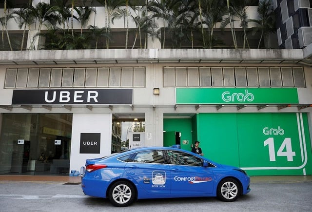 a comfortdelgro taxi passes uber and grab offices in singapore march 26 2018 photo reuters a comfortdelgro taxi passes uber and grab offices in singapore march 26 2018 photo reuters
