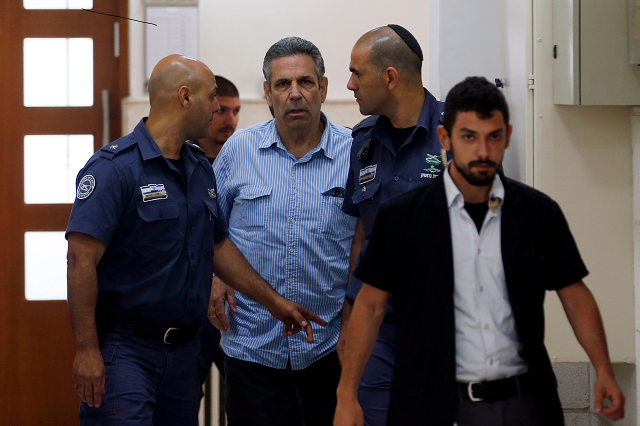 gonen segev a former israeli cabinet minister indicted on suspicion of spying for iran is escorted by prison guards as he arrives to court in jerusalem photo afp