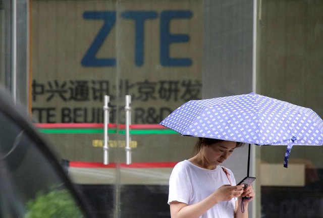 a woman stands outside a building of zte beijing research and development center in beijing china june 13 2018 photo reuters