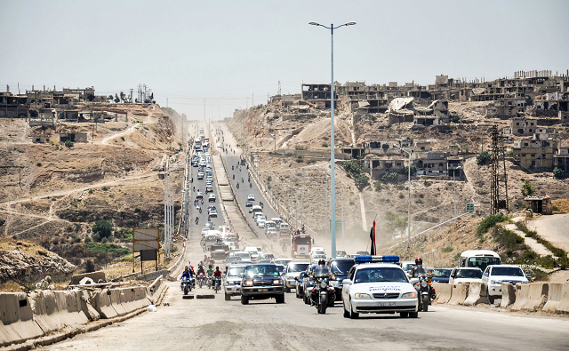 in the central syrian province of homs shows government cars and military vehicles driving along the main highway between homs and hama from second city aleppo all the way down to the border with jordan syria 039 s longest highway photo afp in the central syrian province of homs shows government cars and military vehicles driving along the main highway between homs and hama from second city aleppo all the way down to the border with jordan syria 039 s longest highway photo afp