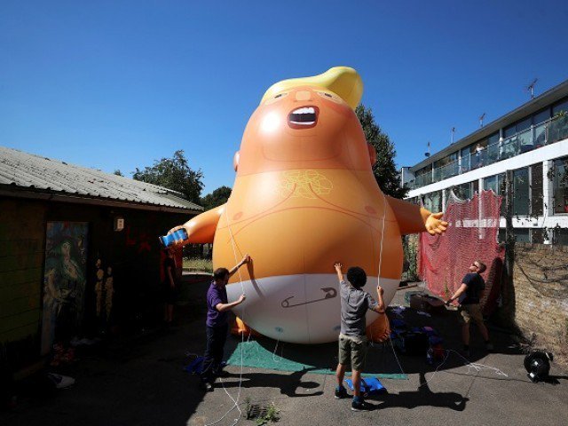 people inflate a helium filled donald trump blimp which they hope to deploy during the president of the united states 039 upcoming visit in london britain june 26 2018 photo reuters