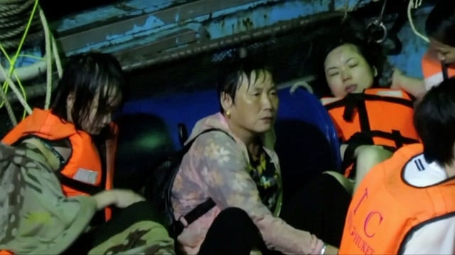 rescued people sit on a fishing boat after a boat they were travelling in capsized off the tourist island of phuket thailand july 5 2018 in this still image taken from video photo reuters rescued people sit on a fishing boat after a boat they were travelling in capsized off the tourist island of phuket thailand july 5 2018 in this still image taken from video photo reuters