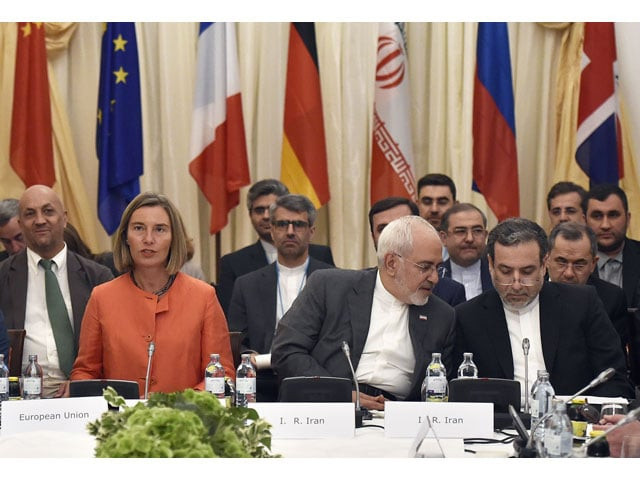 european union high representative for foreign affairs federica mogherini l iranian minister of foreign affairs mohammad javad zarif c and political deputy at the ministry of foreign affairs of iran abbas araghchi take part in a comprehensive plan of action jcpoa ministerial meeting on the iran nuclear deal on july 6 2018 in vienna austria photo afp