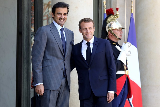 french president emmanuel macron r welcomes qatar sheikh tamim bin hamad al thani at the elysee palace on july 6 2018 in paris photo afp