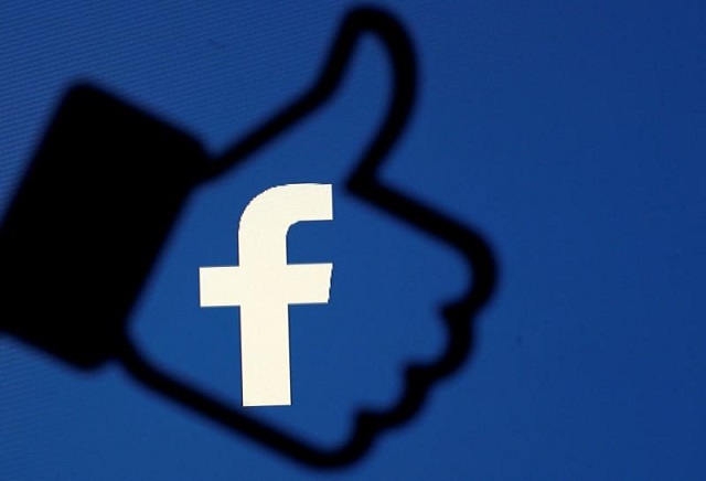 a 3d printed facebook like button is seen in front of the facebook logo photo reuters