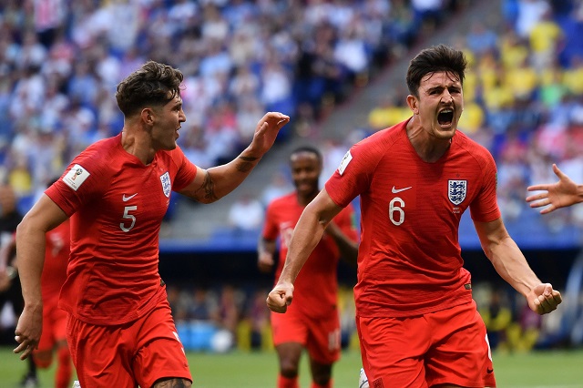 england 039 s defender harry maguire r celebrates past england 039 s defender john stones after scoring the opener during the russia 2018 world cup quarter final football match between sweden and england at the samara arena in samara on july 7 2018 photo afp