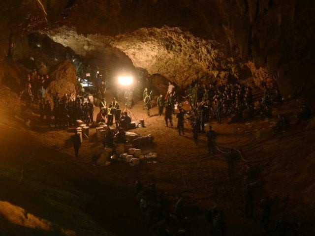 the players remain trapped despite being reached this week by cave diving rescuers who released footage of them looking emaciated but calm some wearing football shirts photo afp the players remain trapped despite being reached this week by cave diving rescuers who released footage of them looking emaciated but calm some wearing football shirts photo afp