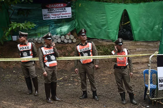 thai police stand guard at the tham luang cave area as operations continue for the 12 boys and their coach trapped at the cave in khun nam nang non forest park in the mae sai district photo afp thai police stand guard at the tham luang cave area as operations continue for the 12 boys and their coach trapped at the cave in khun nam nang non forest park in the mae sai district photo afp