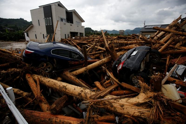 torrential rains that saw some parts of western japan pounded with three times the usual precipitation for a normal july set off landslides and sent rivers surging over their banks trapping many people in their houses or on rooftops photo reuters torrential rains that saw some parts of western japan pounded with three times the usual precipitation for a normal july set off landslides and sent rivers surging over their banks trapping many people in their houses or on rooftops photo reuters