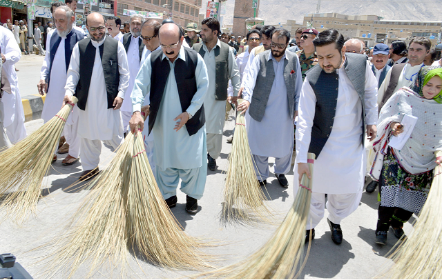 caretaker balochistan chief minister alauddin marri and interim ministers kick of the cleanliness week by sweeping the road with brooms in quetta photo express