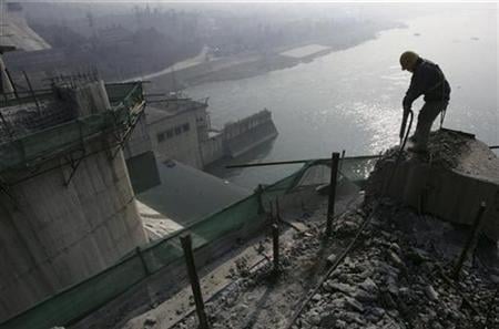 a laborer works a dam photo reuters