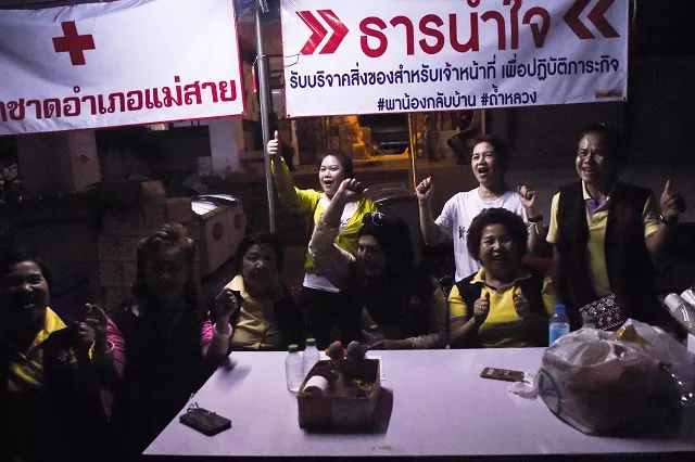 volunteers celebrate at a makeshift press centre in mae sai district of chiang rai province on july 10 2018 after the twelve boys and their football coach were rescued the final five members of a young football team were rescued from a flooded thai cave on july 10 after spending 18 harrowing days trapped deep inside completing an astonishing against the odds rescue mission that captivated the world photo afp volunteers celebrate at a makeshift press centre in mae sai district of chiang rai province on july 10 2018 after the twelve boys and their football coach were rescued the final five members of a young football team were rescued from a flooded thai cave on july 10 after spending 18 harrowing days trapped deep inside completing an astonishing against the odds rescue mission that captivated the world photo afp