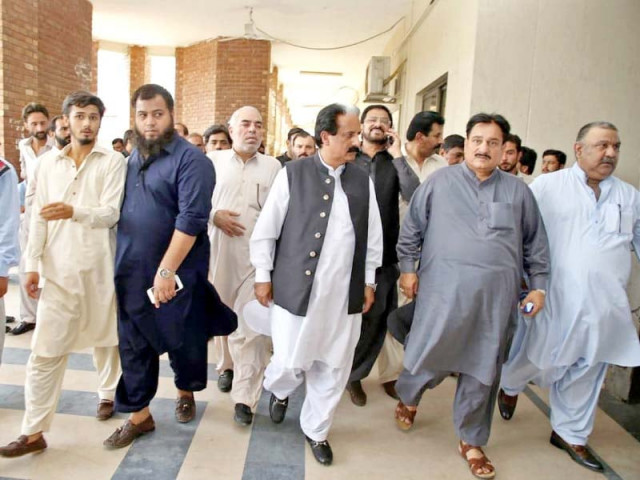 senator tanvir chaudhry walks out of sessions court with other pml n leaders after getting bail on tuesday photo agha mehroz express senator tanvir chaudhry walks out of sessions court with other pml n leaders after getting bail on tuesday photo agha mehroz express