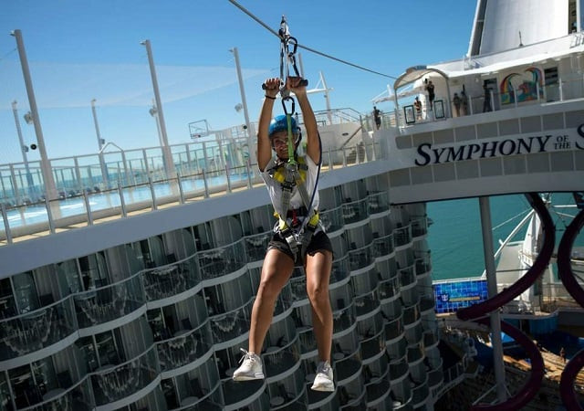 a woman slides down a zip line aboard a royal caribbean 039 s cruise ship photo afp a woman slides down a zip line aboard a royal caribbean 039 s cruise ship photo afp