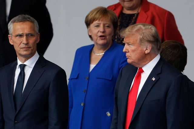 nato secretary general jens stoltenberg german chancellor angela merkel and us president donald trump talk during a family photo ahead of the opening ceremony of the nato north atlantic treaty organization summit at the nato headquarters in brussels on july 11 2018 photo afp