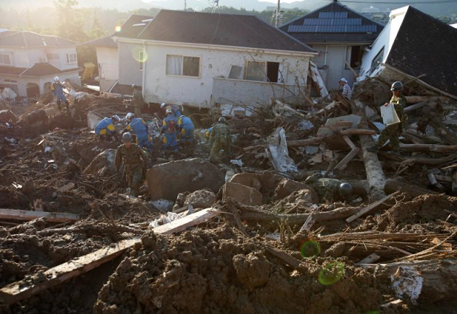 more than 70 000 military police and firefighters toiled through the debris in a grim search for the missing photo reuters more than 70 000 military police and firefighters toiled through the debris in a grim search for the missing photo reuters