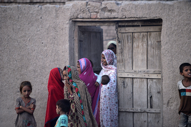 pakistani villager women gather outside their home in mohri pur village where women had previously been banned from voting photo afp pakistani villager women gather outside their home in mohri pur village where women had previously been banned from voting photo afp