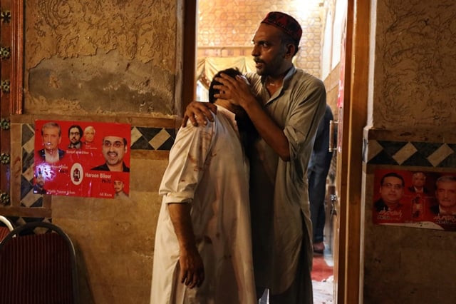 a party worker comforts another after the attack that killed at least 20 people photo reuters a party worker comforts another after the attack that killed at least 20 people photo reuters
