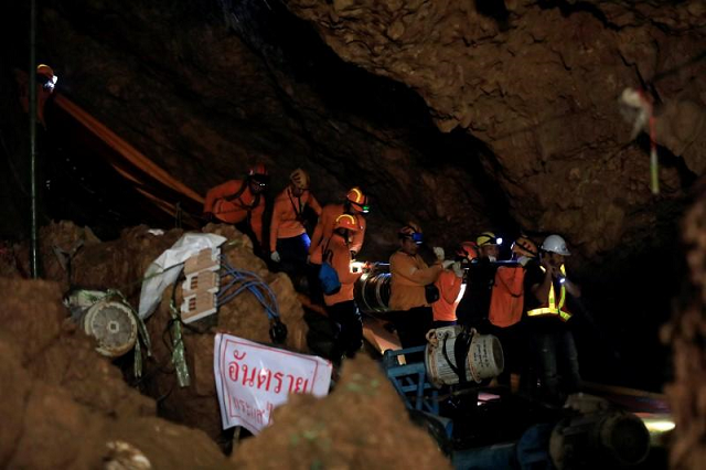 a huge media pack of more than 1 000 journalists gathered at the mouth of the cave feeding audiences all over the globe with every twist and turn of the dramatic rescue until its joyful conclusion on tuesday photo reuters