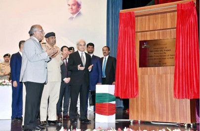 caretaker pm rolls out pak china optical fiber cable project