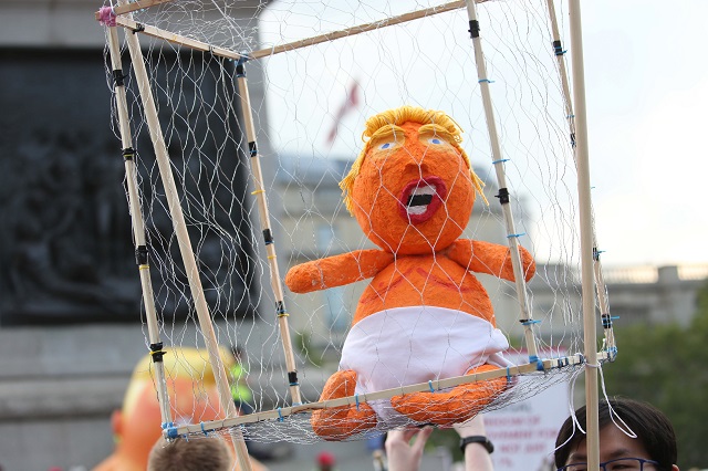 a baby trump in a cage is seen in trafalgar square as a demonstration against the uk visit of us president donald trump takes place in london on july 13 2018 photo afp