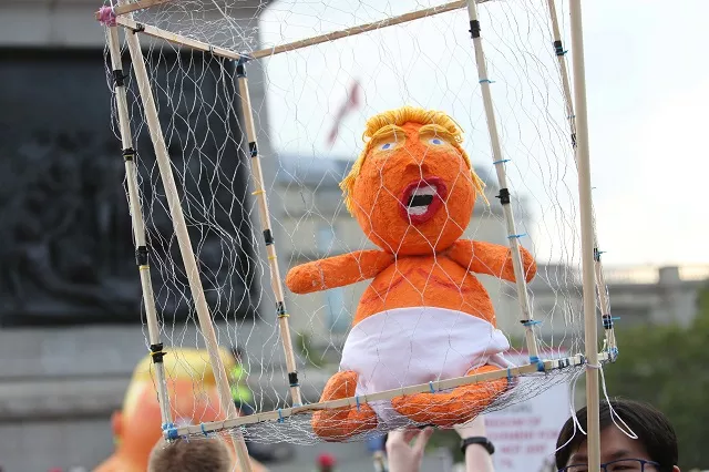 a baby trump in a cage is seen in trafalgar square as a demonstration against the uk visit of us president donald trump takes place in london on july 13 2018 photo afp a baby trump in a cage is seen in trafalgar square as a demonstration against the uk visit of us president donald trump takes place in london on july 13 2018 photo afp