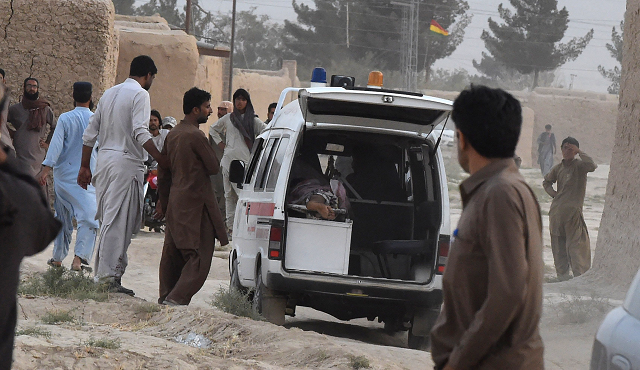 emergency workers shuttled victims to nearby vehicles from the bombed out compound as bystanders sobbed in the darkness owing to the waning electricity in the impoverished area photo afp