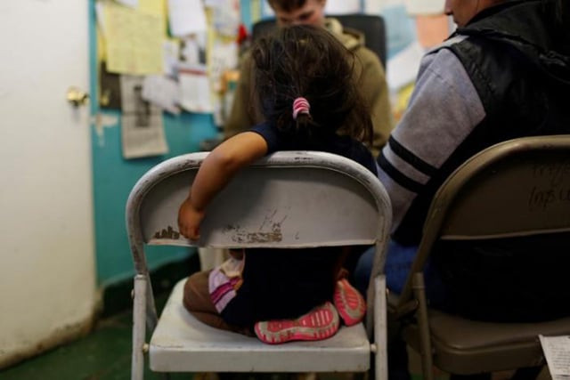 an undocumented immigrant family from guatemala talks to a volunteer after their arrival photo reuters an undocumented immigrant family from guatemala talks to a volunteer after their arrival photo reuters