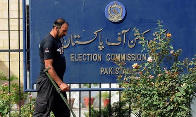 a security man walks outside the election commission of pakistan building in islamabad photo afp