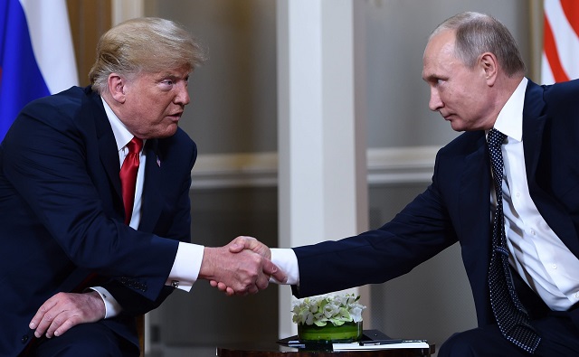 russian president vladimir putin r and us president donald trump shake hands before a meeting in helsinki on july 16 2018 photo afp