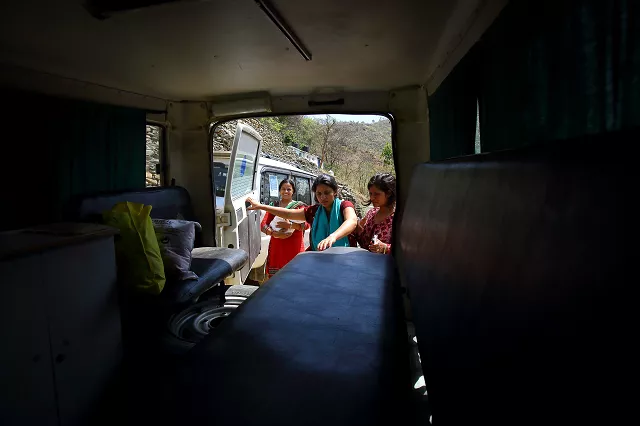 nepali mother pabitra dhungel getting into an ambulance a day after giving birth at a health centre in the ramechhap district photo afp nepali mother pabitra dhungel getting into an ambulance a day after giving birth at a health centre in the ramechhap district photo afp