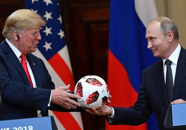 russia 039 s president vladimir putin r offers a ball of the 2018 football world cup to us president donald trump during a joint press conference after a meeting at the presidential palace in helsinki on july 16 2018 photo afp russia 039 s president vladimir putin r offers a ball of the 2018 football world cup to us president donald trump during a joint press conference after a meeting at the presidential palace in helsinki on july 16 2018 photo afp