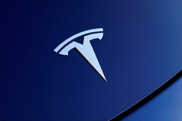 the front hood logo on a 2018 tesla model 3 electric vehicle is shown in this photo illustration taken in cardiff california us june 1 2018 photo reuters the front hood logo on a 2018 tesla model 3 electric vehicle is shown in this photo illustration taken in cardiff california us june 1 2018 photo reuters