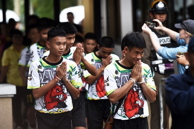 the young footballers and their coach appeared healthy when they appeared before the media for the first time on july 18 photo afp the young footballers and their coach appeared healthy when they appeared before the media for the first time on july 18 photo afp