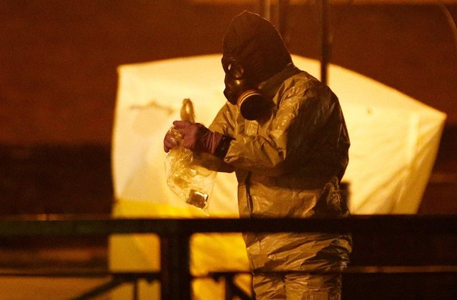 members of the emergency services wearing protective clothing work near the bench where former russian intelligence officer sergei skripal and his daughter yulia were found poisoned in salisbury britain march 13 2018 photo reuters